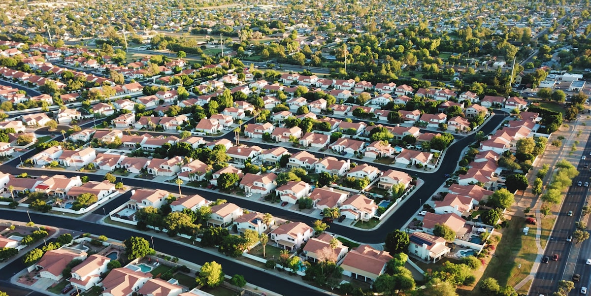 Aerial drone view of a suburban subdivision at golden hour